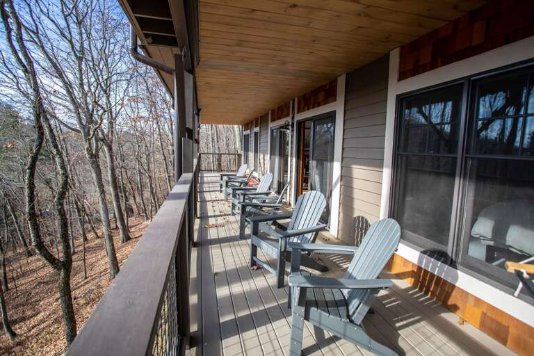 Lower Covered Deck with Comfortable Seating and Corn Hole Boards