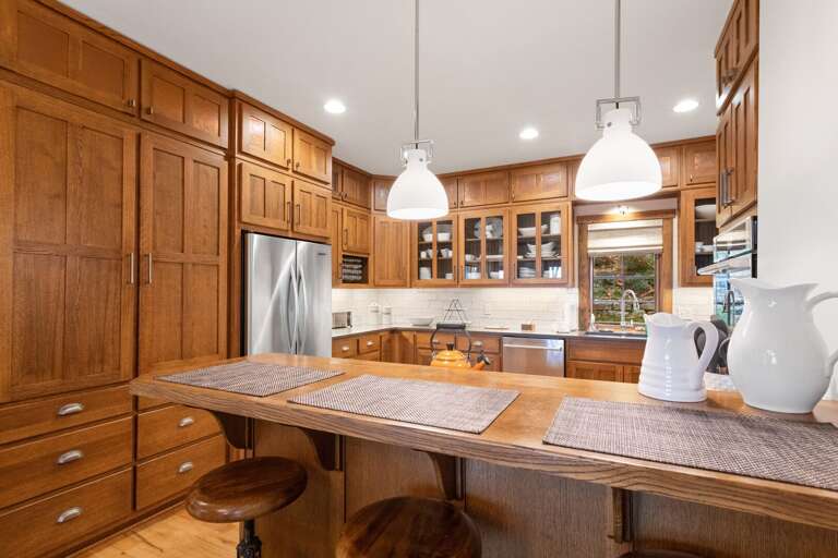 Fully Stocked Kitchen with Preparation Space and Serving Essentials