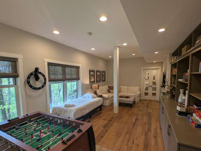 Lower level family room with twin bed