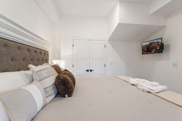 King Bed, TV and Ensuite Bathroom in the Lower Level Master Bedroom King Bed, TV and Ensuite Bathroom in the Lower Level Master Bedroom