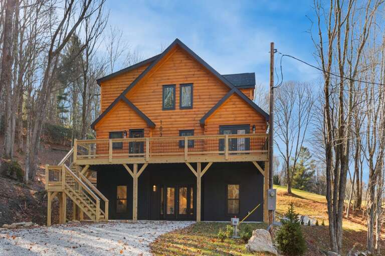 Level Gravel Driveway and Entrance Through the Lower Level Level Gravel Driveway and Entrance Through the Lower Level