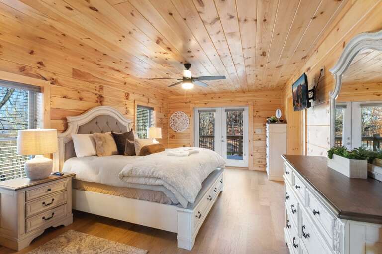 Main Floor Master Bedroom with TV and Deck Access Main Floor Master Bedroom with TV and Deck Access