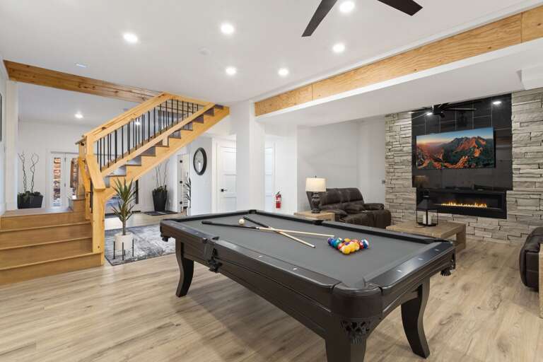 Pool Table, Gas Fireplace and Big Screen TV in the Game Room Pool Table, Gas Fireplace and Big Screen TV in the Game Room