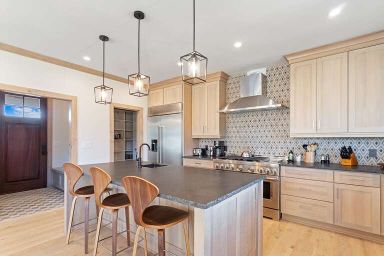 Large Island with Granite Countertop and Seating for Three