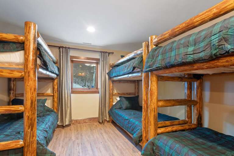 Lower Level Bunk Room with Six Twin Beds (Ladders Have Been Added Since this Picture) and Ensuite Bath
