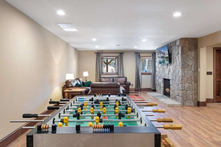Lower Level Family Room with Foosball Table, Gas Fireplace and TV