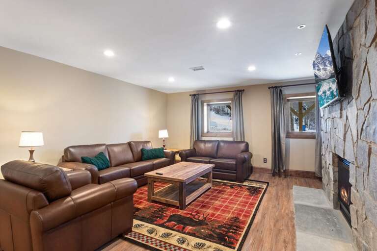 Second Living Area Downstairs Looks Out on the Slopes With Foosball Table and Large Screen Roku TV with Spectrum Cable Package