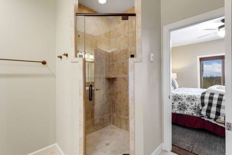 Ensuite Bathroom in the Lower Level King Bedroom with Tiled Step in Shower Ensuite Bathroom in the Lower Level King Bedroom with Tiled Step in Shower