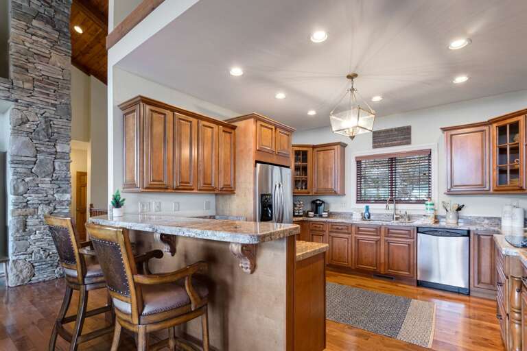 Kitchen with Granite Counters, Stainless Appliances and Bar Seating Kitchen with Granite Counters, Stainless Appliances and Bar Seating