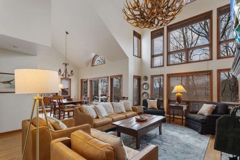 Open Main Floor Living Area With a Wall of Windows for Natural Light