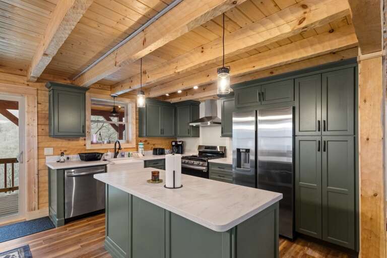 Spacious Kitchen with Quartz Countertops and Stainless Steel Appliances