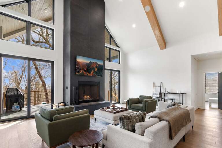 Floor to Ceiling Windows Creating a Warm Living Room
