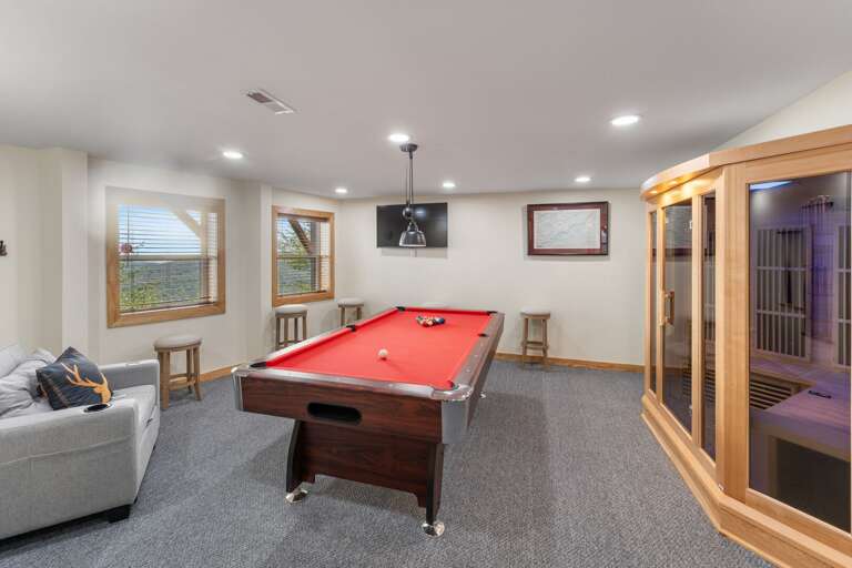 Lower Level Game Room with Pool Table, TV and a Dry Sauna