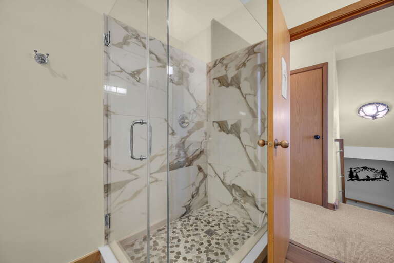 Main Floor Common Bathroom with Jetted Tub and Tile Step-In Shower