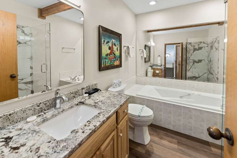 Main Floor Full Common Bathroom with Jetted Tub and Tile Step-In Shower