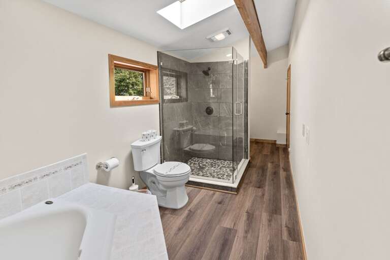 Upper Level Hall Bathroom with Stone Shower and Jetted Tub