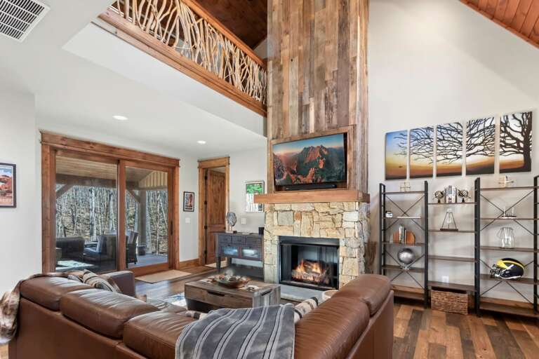 Living Room has TV, Gas Fireplace and Leather Sofa. Sofa Converts to a Queen Sleeper for Two.