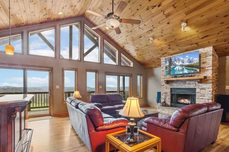 Living Room with Leather Furniture, Gas Fireplace, and TV
