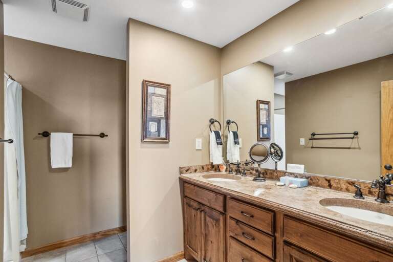 Private Ensuite with Double Vanities and Step-In Shower