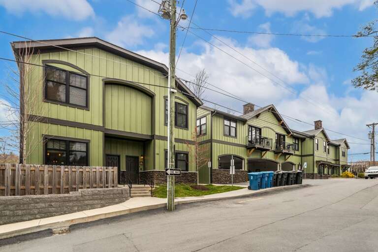 The Appalachian is the Townhome on the Left, with Parking Garage for One Car in the Middle Building
