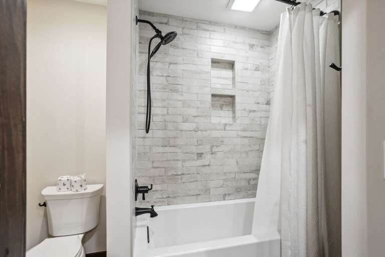 Jack-N-Jill Bathroom with Tiled Tub/Shower Combo