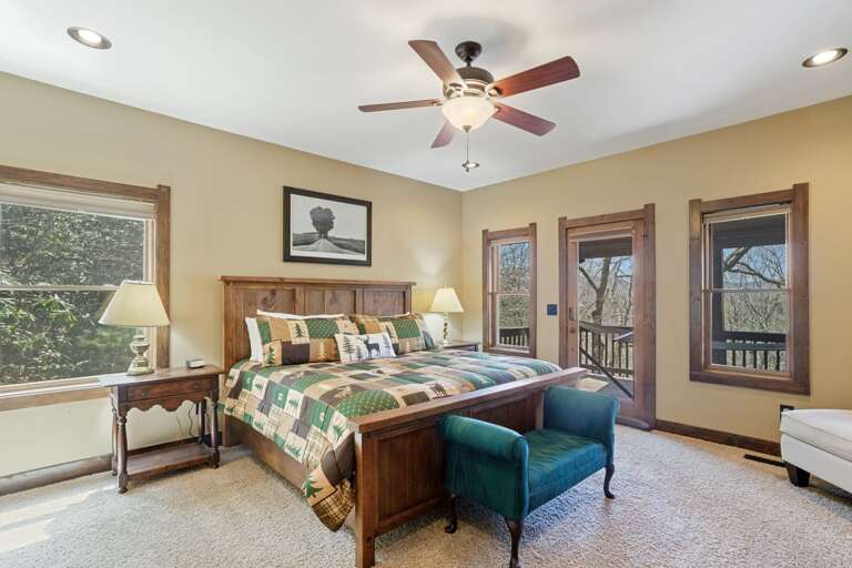 Master Bedroom on the Main Floor with King Bed and Access to the Covered Deck