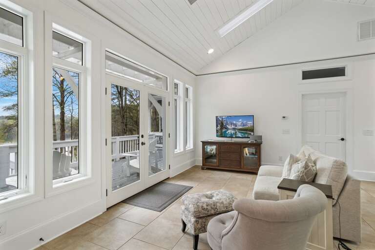 Main Floor Den with TV and Views of the Lake