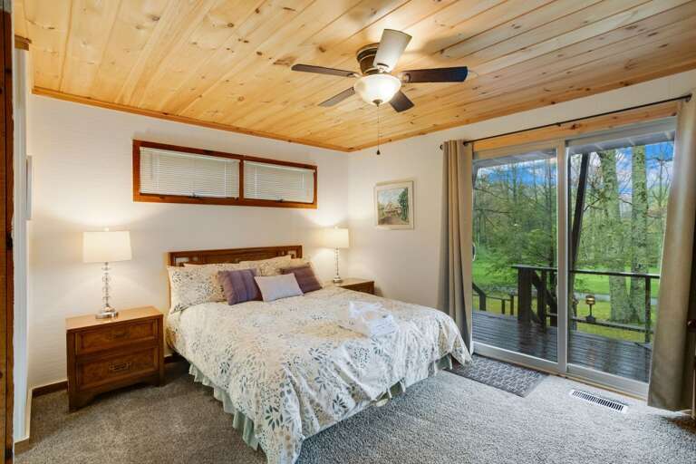 Main Floor Queen Bedroom with Jack-N-Jill Bathroom and Deck Access