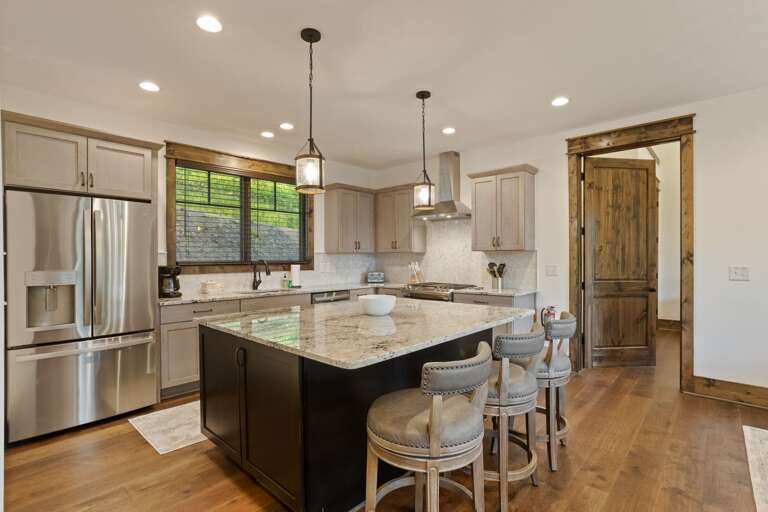 Spacious Kitchen with Granite Counters and Stainless Appliances