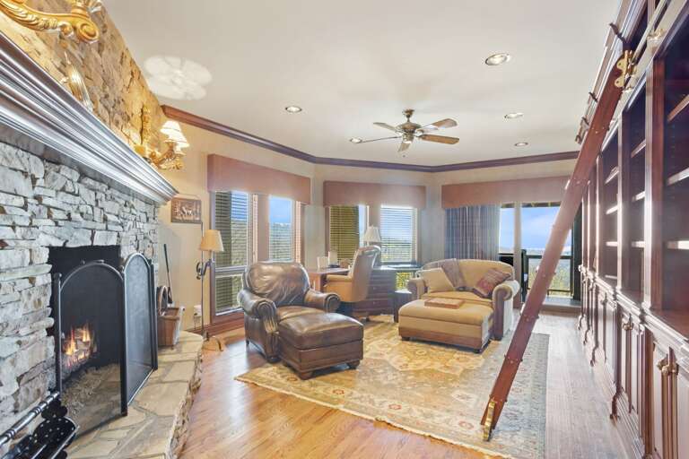 Library on the Middle Level with Gas Fireplace and Access to the Deck
