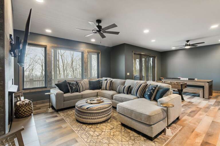 Lower Level Family Room with Foosball and Game Table that Converts to Ping Pong or Pool Table