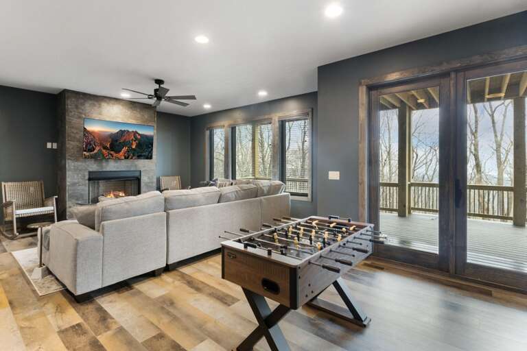 Lower Level Family Room with Foosball, TV and Gas Fireplace