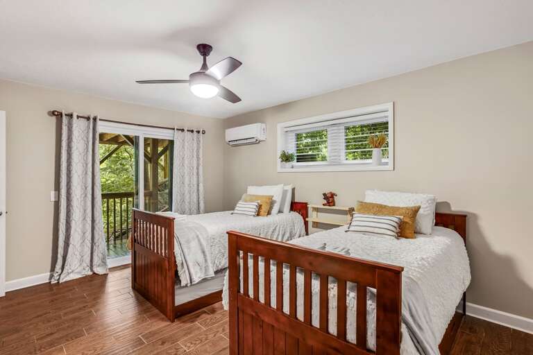 Lower Level Twin Bedroom with Sleeping for 4 in 2 Twins and 2 Trundles. There is Deck Access From This Room