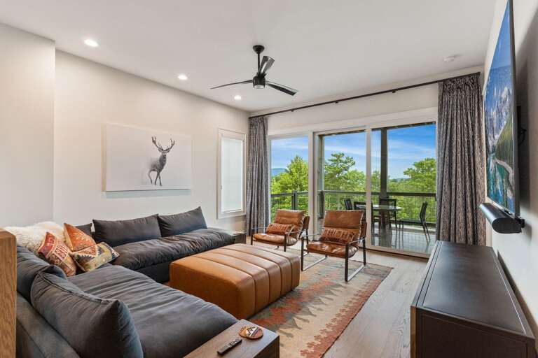 Lower Level Den with Large Sectional, Smart TV, and Access to the Hot Tub Deck Lower Level Den with Large Sectional, Smart TV, and Access to the Hot Tub Deck