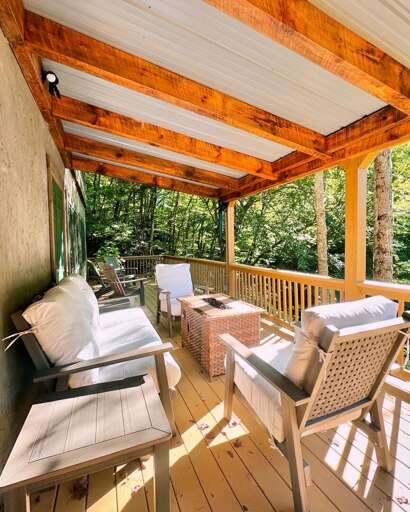 Lower Level Covered Deck with Fire Table and Comfortable Furniture Lower Level Covered Deck with Fire Table and Comfortable Furniture