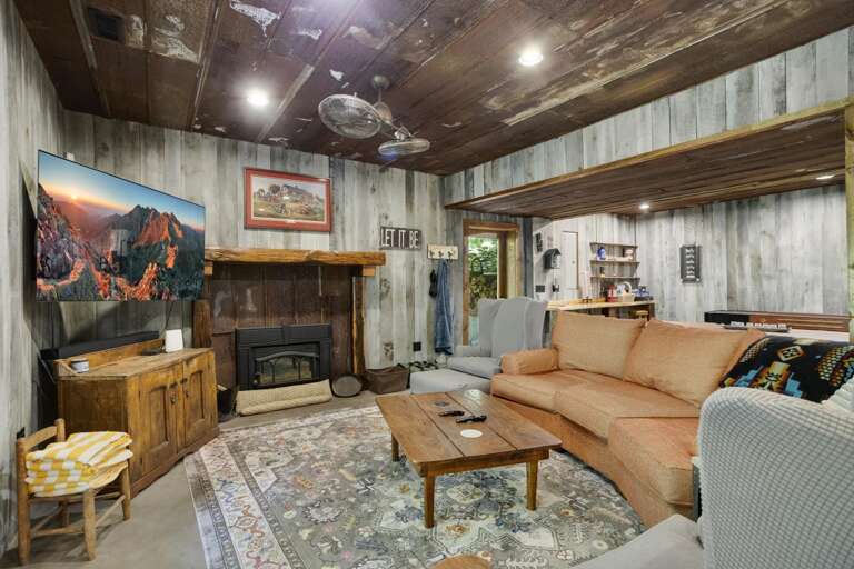 Lower Level Game Room with Large TV, Shuffleboard Table, Darts, and Bar Lower Level Game Room with Large TV, Shuffleboard Table, Darts, and Bar