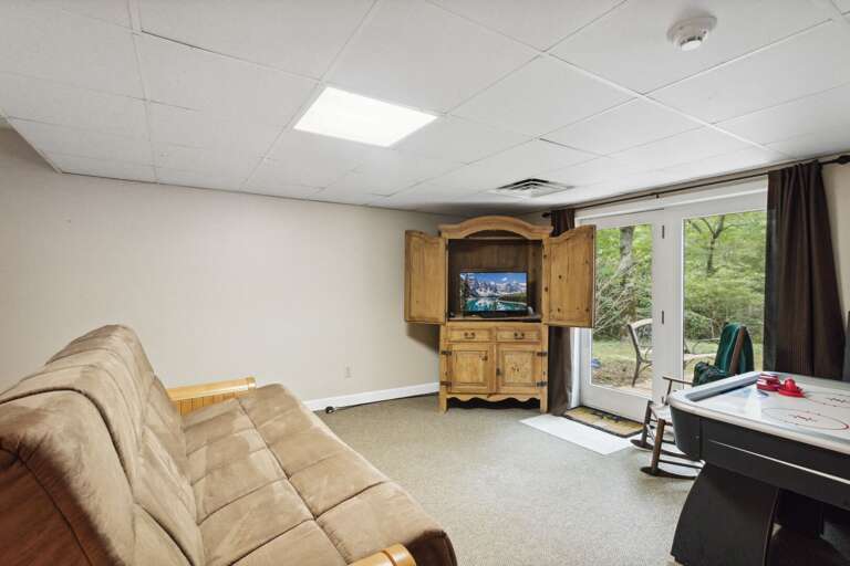 Lower Level Den with Air Hockey Table and Ping Pong Table