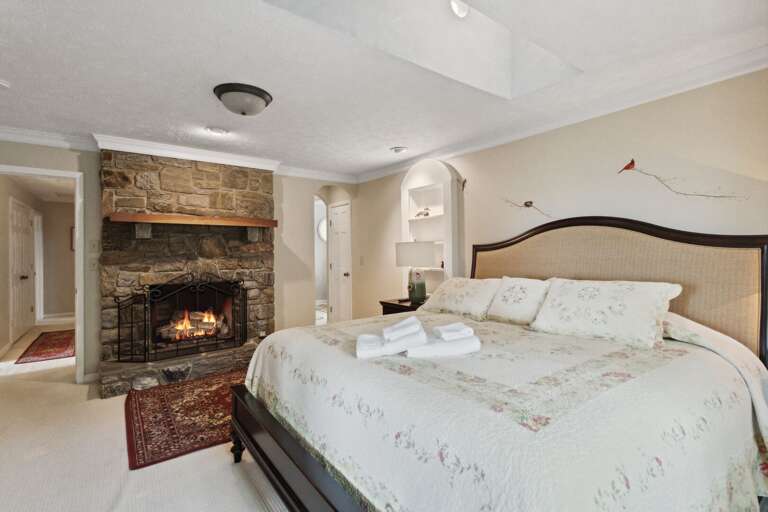 Master Bedroom on the Top Floor with King Bed and TV and Fire Place