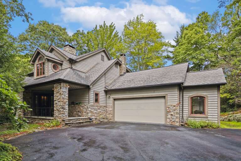 Paved Driveway with Parking for Three Vehicles. The Garage is Not Guest Accessible