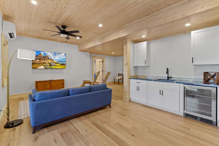 Lower Level has TV area, Beverage Chiller and Sink with Game Tables