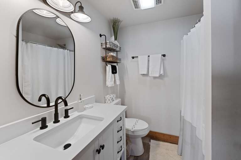 Main Floor Jack-and-Jill Bathroom with a Step-In Shower