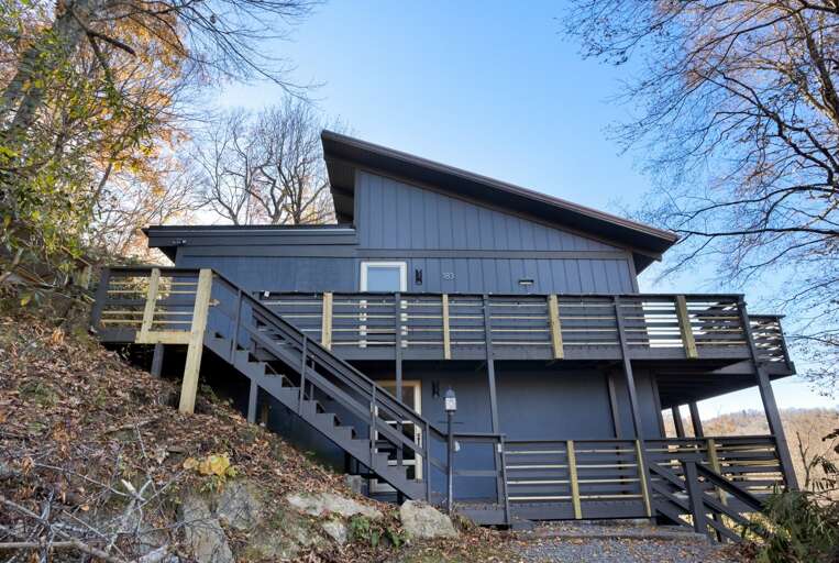 Lower Level and Flight of Steps to the Upper Level Deck from the Gravel Parking Area