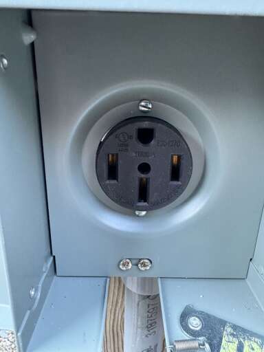 EV charging (NEMA 14-50 plug near parking area)