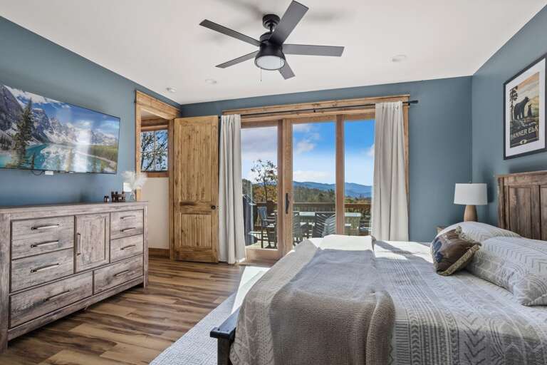King Bed, TV and Deck Access in the Master Bedroom