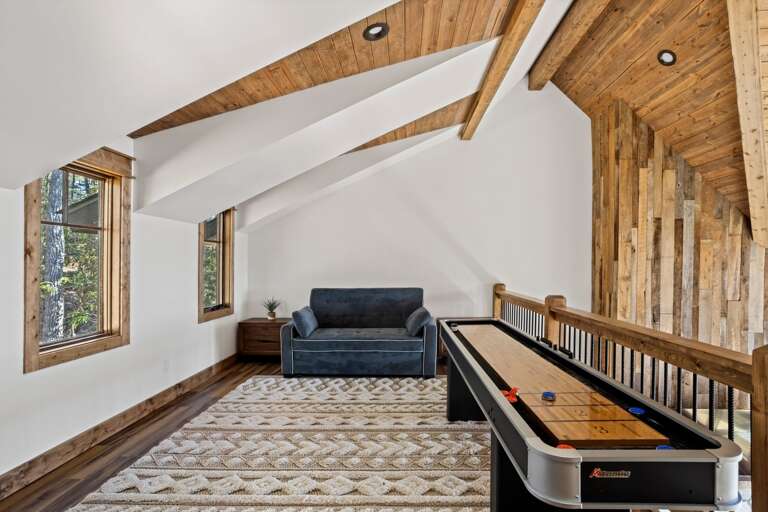 Loft Game Room with Shuffleboard Table and a Sleeper Sofa