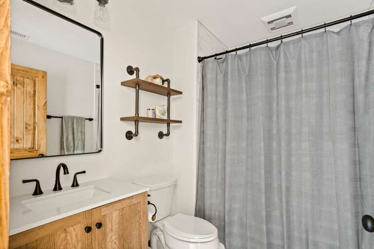 Upstairs Full Shared Bathroom with a Tub and Shower Combo