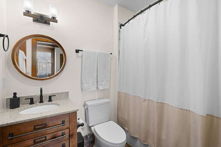 Upper Level Jack-and-Jill Bathroom with Hallway and Queen Room Access