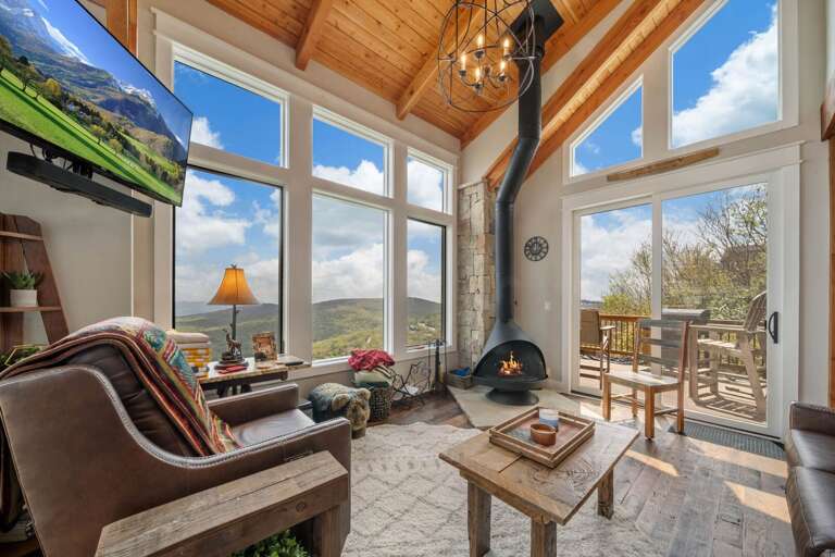Leather Furniture, TV and Cathedral Ceiling Surrounded by Views