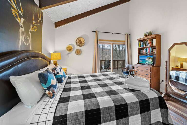 Queen Bed and TV with Deck Access in the Master