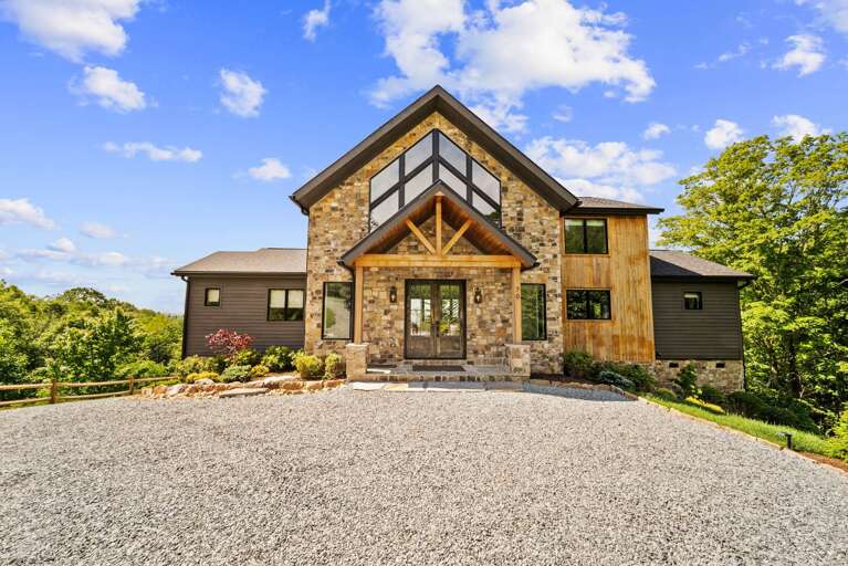 Front Entrance with Impressive Stone and Woodwork